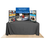 Promoter backlit table top display with images on white background.