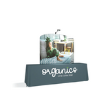 A waveline tension fabric 6ft curved display on a white backdrop.