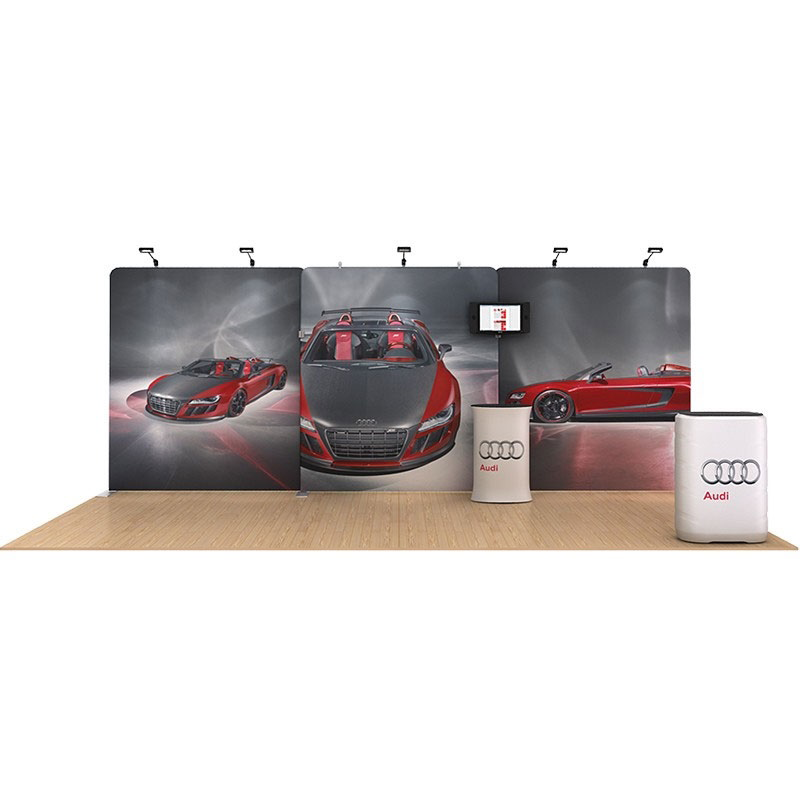 a pop up trade show wall with podium on a wooden floor. 